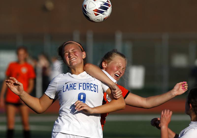 Lake Forest's Ryan Rice battles with Crystal Lake Central's Lizzie Gray for the ball during a Class 2A Deerfield Sectional semi-final match on Tuesday, May 21, 2024, at Deerfield High School.