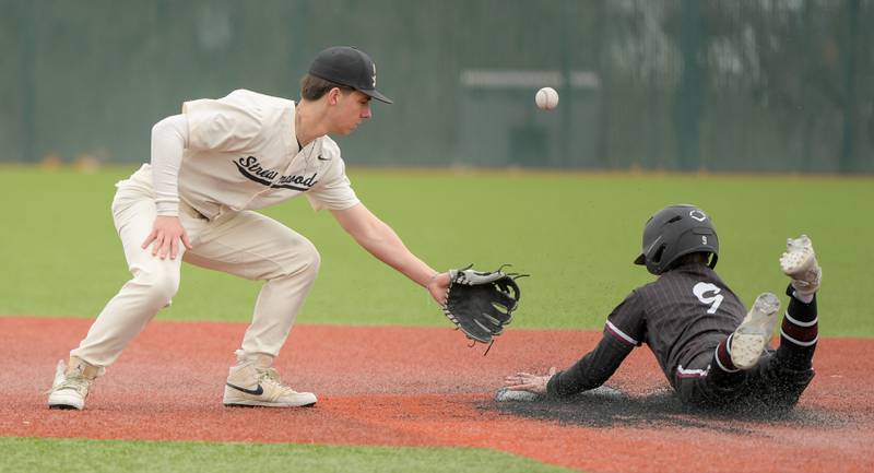 Streamwood's Chris Cole (7) misses the ball allowing Marengo's Caden Sauder (9) to safely drive into second during a game on Monday, March 25, 2024 in Carol Stream.