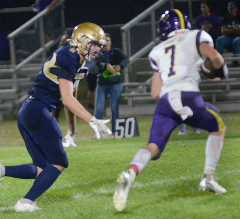 Polo's Damon Rowe moves in to sack Orangeville's Brock Komprood during 8-man action at Polo High School on Friday, Oct. 3, 2025.