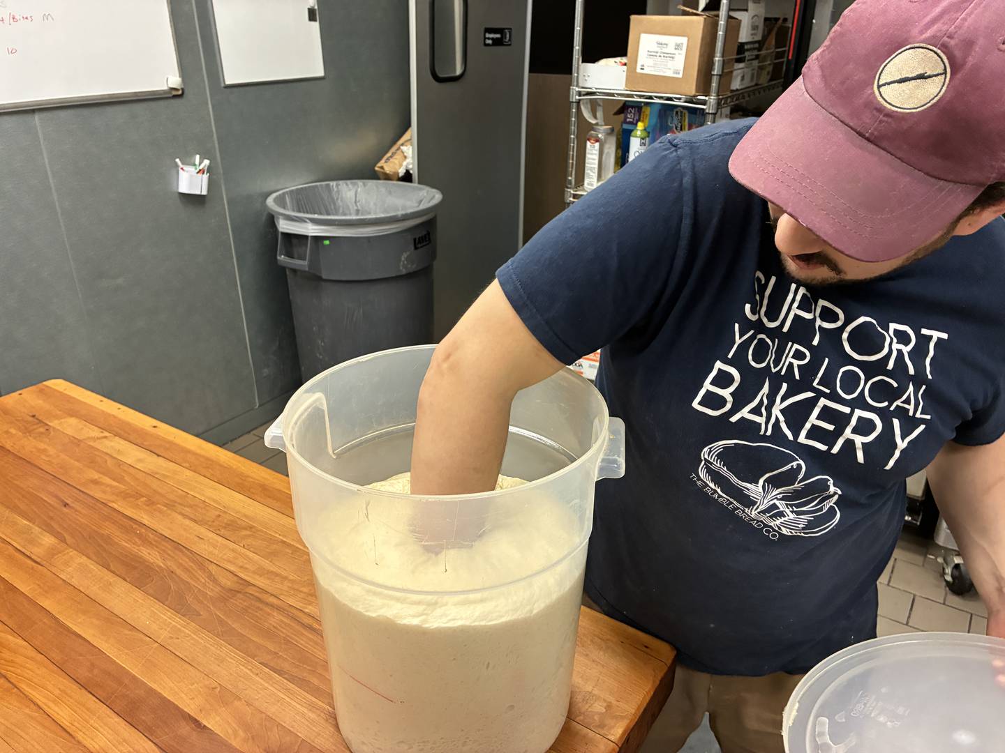 Danny Springer at Bumble Bread Co. punches down a batch of bread dough on Tuesday, Feb. 24, 2026. After a rough first year in McHenry, Springer said the bakery's business is on the rise.