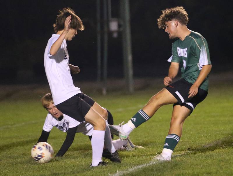 St. Bede's Mark Rudenko kicks the ball past Abingdon-Avon defenders on Wednesday, Oct. 15, 2025 at St. Bede Academy.