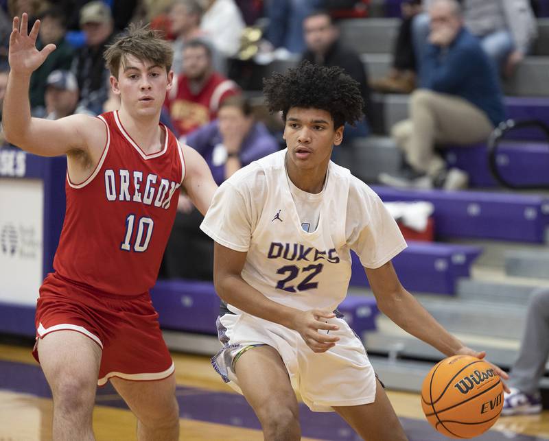 Dixon’s Xavion Jones handles the ball against Oregon’s Keaton Salsbury Tuesday, Feb. 3, 2026.