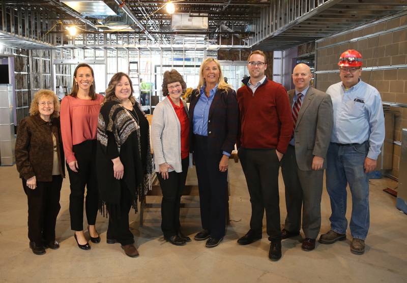 Lighted Way board members (from left) Adriane Shore, Leah Inman, Ellen Credi, Executive Director Jessica Kreiser, State Sen. Sue Rezin (R-Morris,) Scott Schweickert, Chris Vaske and Tieman Builders Inc. owner Dean Tieman pose for a photo at the current Lighted Way building on Monday, Jan. 23, 2023 in La Salle.