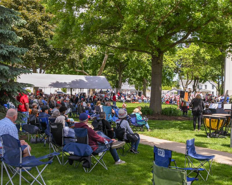 Attendees listen to Masters Sargent Devin Persaud speak during the Memorial Day event on Monday May 26, 2025, held at Town Square Park in Yorkville.