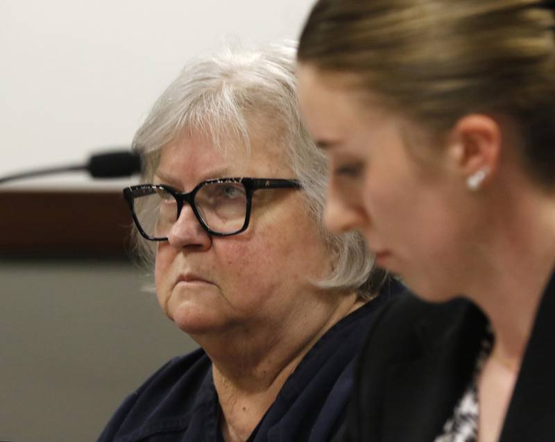 Roxanna L. Collins, 70, of McHenry, listens to court proceedings next to defense attorney Jennifer Recktenwald on Tuesday, June 3, 2025, during Collins’ initial appearance before Kenosha County Court Commissioner William Michel. She was charged with first-degree intentional homicide in the 2003 death of her husband, David Vanderzee.