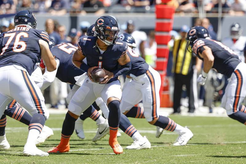 Chicago Bears quarterback Justin Fields looks to pass the ball against the Tennessee Titans during the first half of a preseason game, Saturday, Aug. 12, 2023, in Chicago.