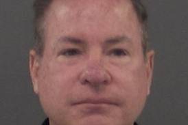 Ex-Bolingbrook music teacher surrenders to police in battery of a minor case