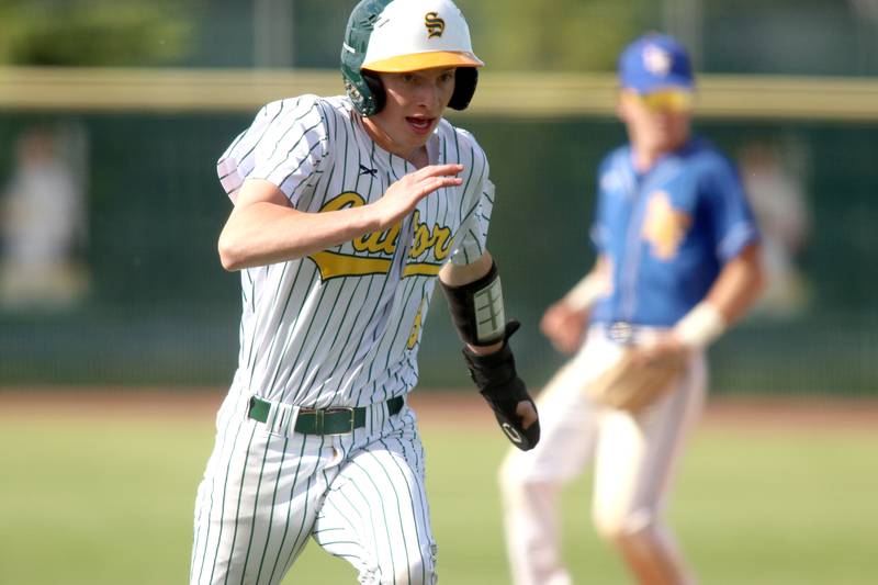 Crystal Lake South’s Drew Watson motors around third en route to scoring against Lake Forest in Class 3A baseball regional action at Crystal Lake Thursday.