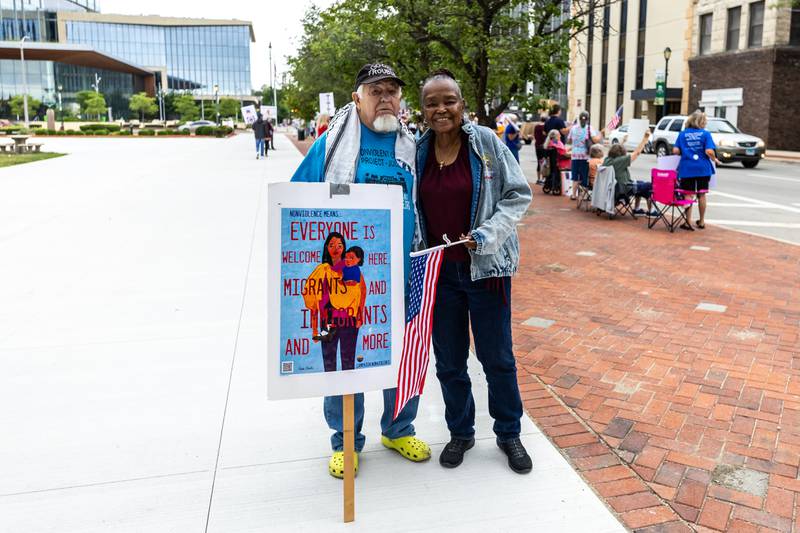 Doug Kasper and Phyllis Toliver stop for a photo during the Good Trouble Lives On event in Downtown Joliet on July 17, 2025.