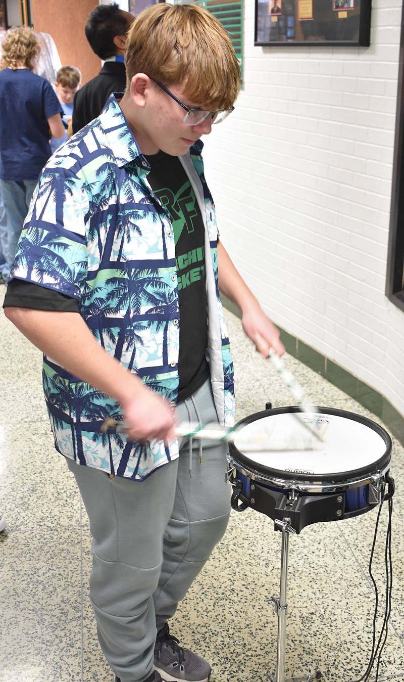 Cullen Jordan, a freshman from Rock Falls, tests his drum stroke speed Sunday, Feb. 22, 2026, during the 12th annual Percussion Palooza.