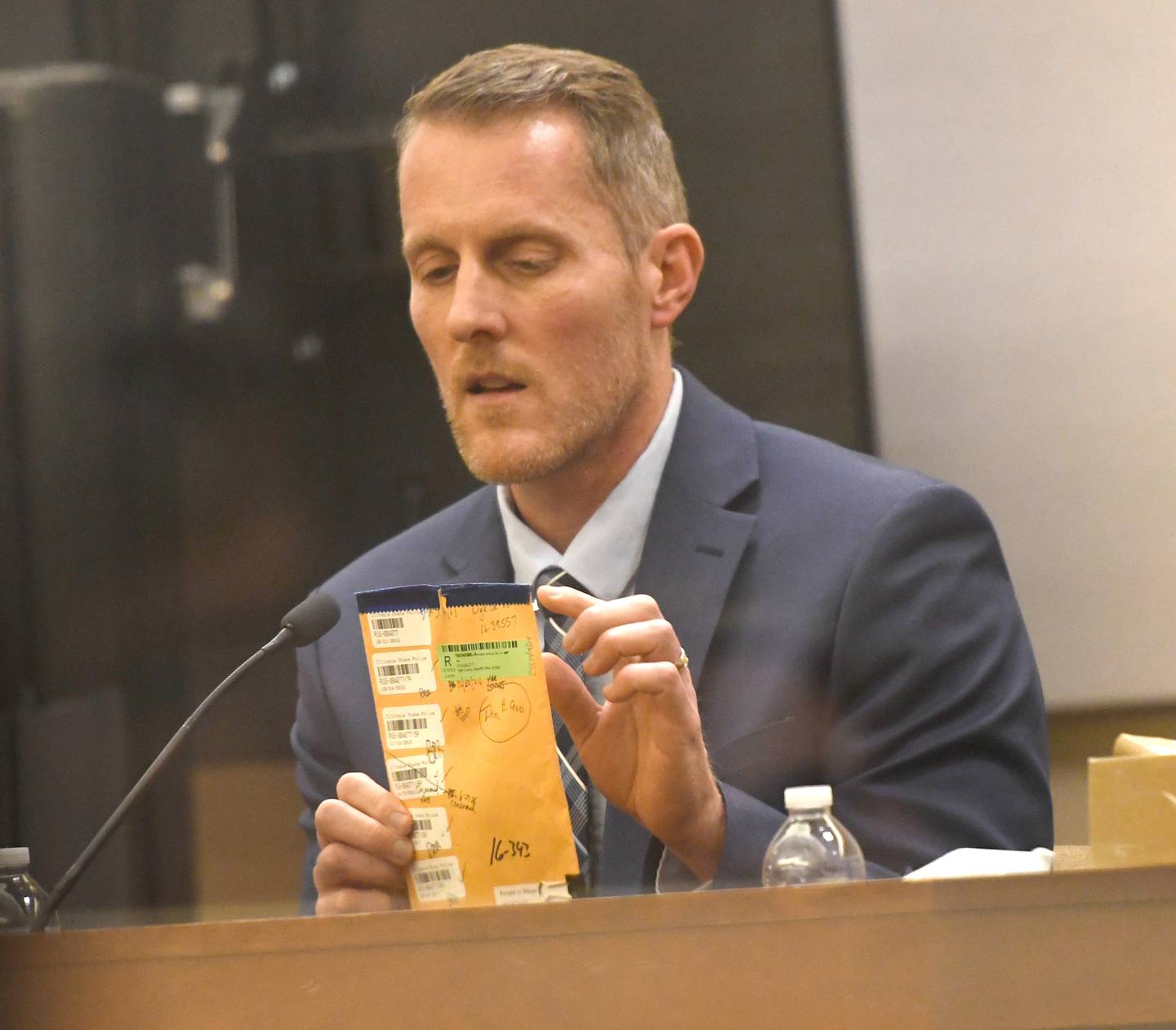 Illinois State Police Forensic Scientist Blake Aper testifies Wednesday, Jan. 21, 2026 to results from blood and DNA samples gathered by investigators after Maggie Meyer's charred body was found dead inside her Byron home in October 2016. Her ex-husband,  Duane C. Meyer, is charged with murder and arson.