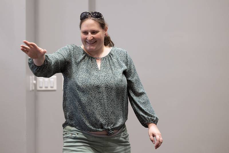 Whitney Cushing smiles and waves after being named a Walter Gronner Best Worker Award recipient Thursday, Oct. 17, 2024, at the Self Help client awards banquet.