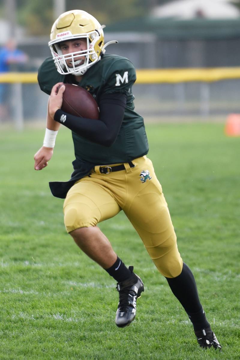 Bishop McNamara's Karter Krutsinger runs for a touchdown during a home game against Marian Central Saturday, Oct. 4, 2025.