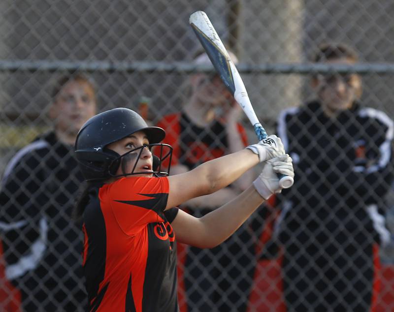 Crystal Lake Central's Olivia Shaw watches her two run scoring double fly during a nonconference softball game Wednesday March 16, 2022, between Crystal Lake Central and Richmond-Burton at Lippold Park in Crystal Lake.