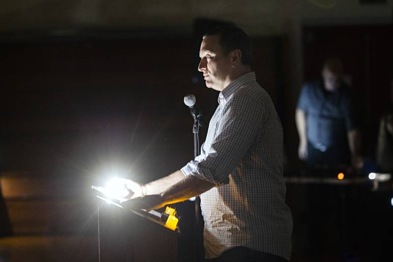 Pastor Isaac Newman speaks Sunday, March 31, 2024 to the hundreds of people attending a candlelit vigil in memory of three local teens who died in a Thursday collision.