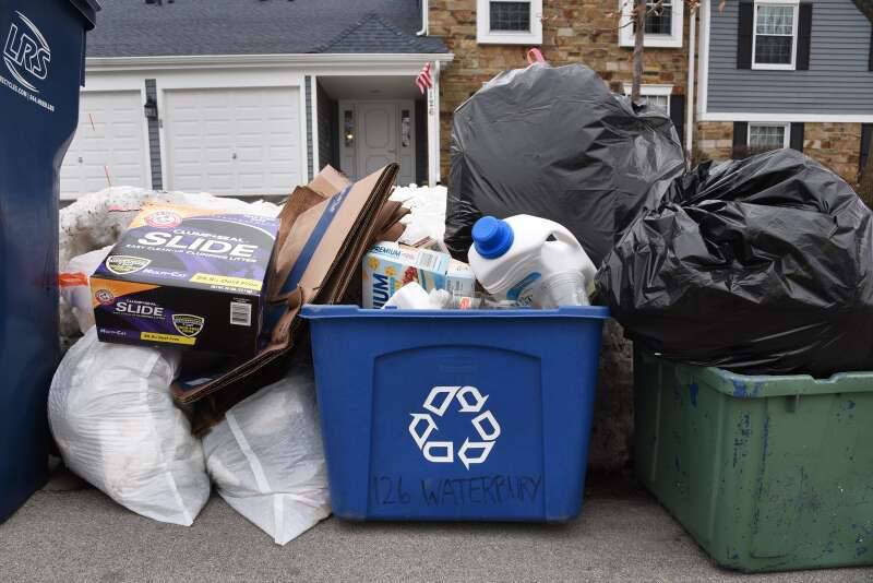 A bin of recyclables is ready for pickup along Waterbury Lane last week in Schaumburg