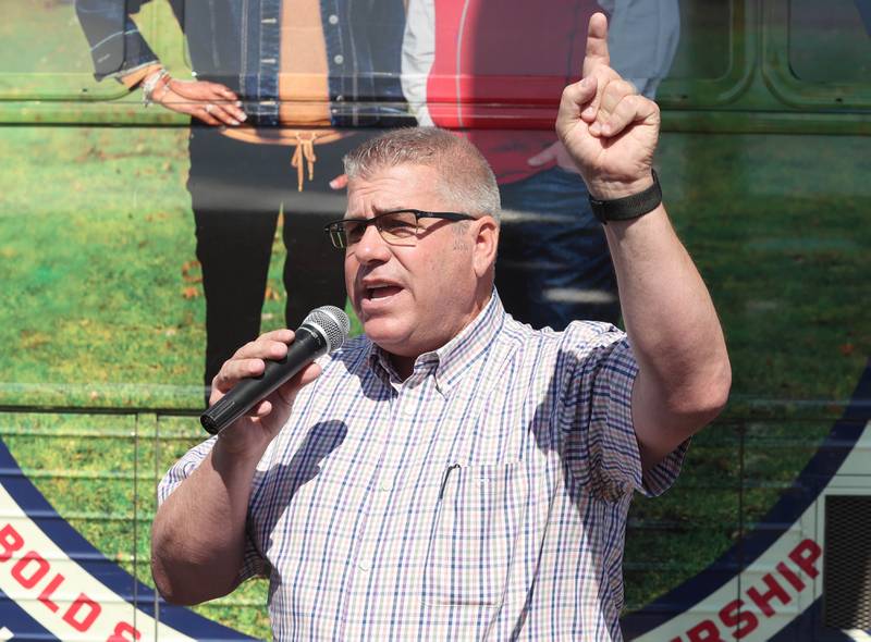 Darren Bailey, a Republican candidate for Illinois governor, speaks in front of his bus Friday, June 17, 2022, during his campaign stop at Tom and Jerry's in Sycamore. Bailey is currently on a bus tour across the state that will cover 102 countys in 14 days.