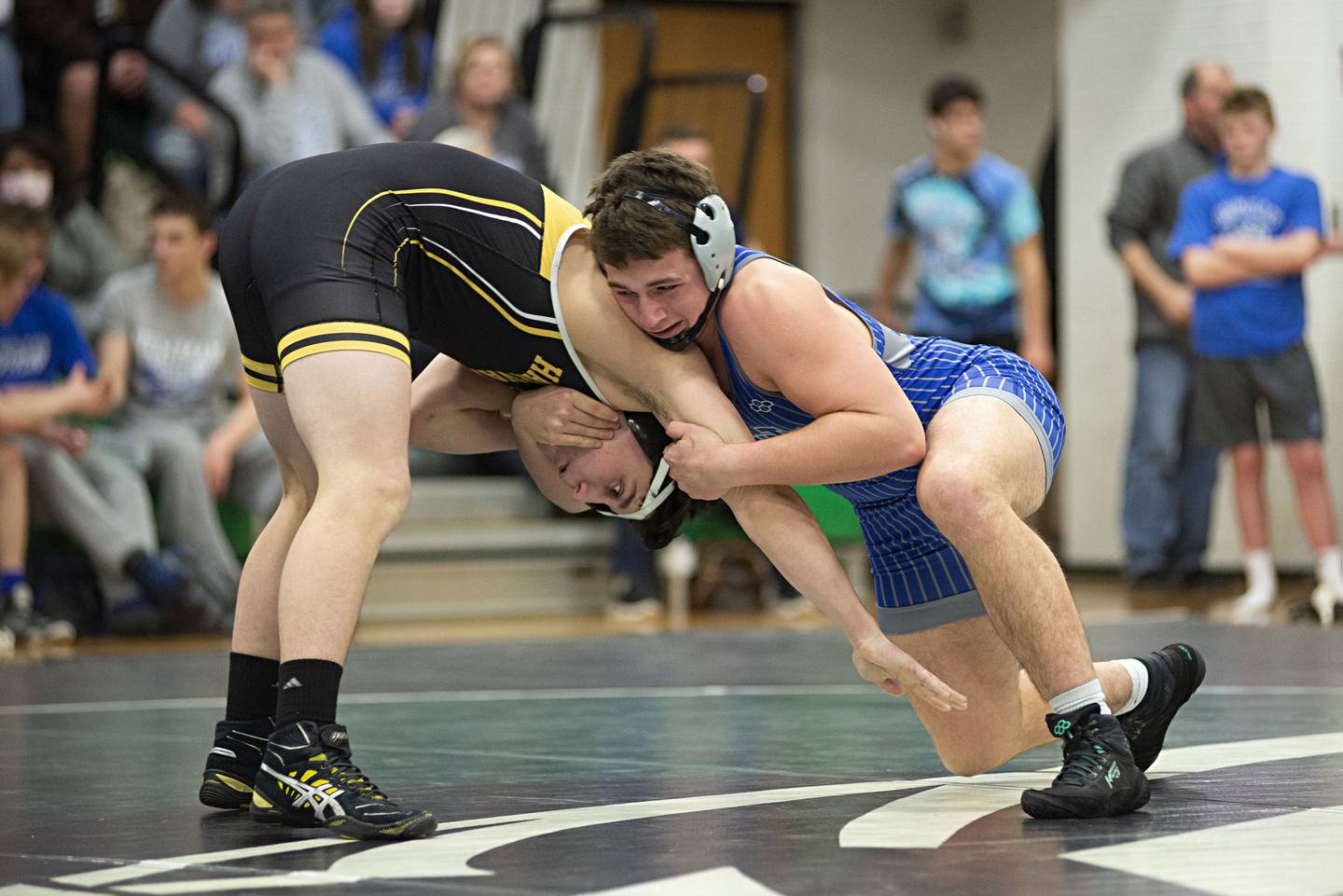 Newman's Hunter Luyando works against Harvard's Caden Scott at 170lbs in the team wrestling sectional in Rock Falls on Tuesday, Feb. 22, 2022.