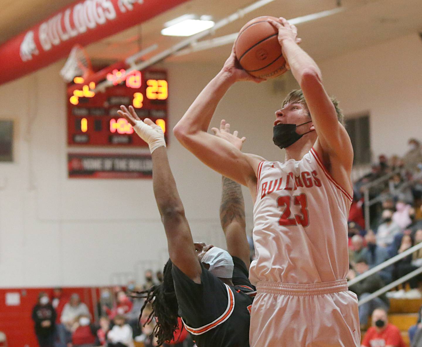 Streator's Jack Haynes (23) shoots a short jumper over DeKalb's Demarrea Davis (20) on Saturday, Jan. 22, 2022, in Streator.