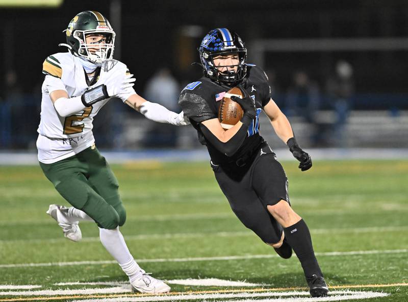 Lincoln-Way East's wide receiver Mj Schley (10) catches a pass for a first down during the IHSA Class 8A Quarterfinals game against Stevenson on Friday, Nov. 15, 2024, at Frankfort. (Dean Reid for Shaw Local News)