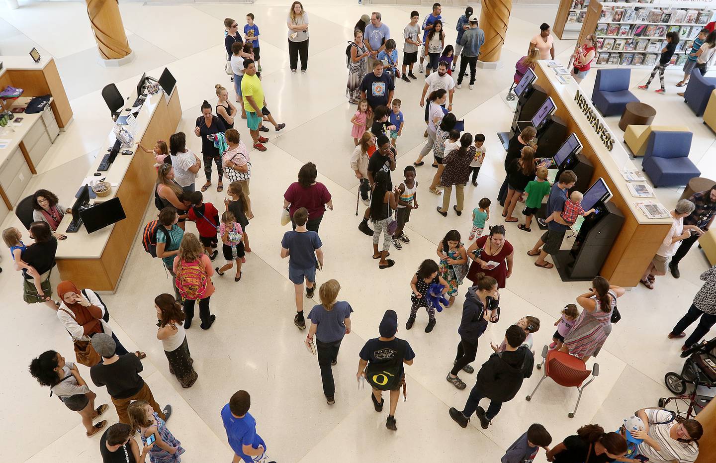 Hundreds of people came out to the DeKalb Public Library in DeKalb for a solar eclipse program on Monday, Aug. 21, 2017. The library offered free solar eclipse glasses, but all 60 glasses were given out within a few minutes. The library also offered crafts for children and a livestream broadcast of the eclipse.