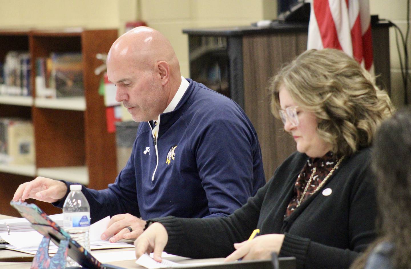 Sterling Public Schools Superintendent Tad Everett and Board of Education President Pam Capes review their agenda before the measure on SPS University is introduced on Wednesday, March 22, 2023.