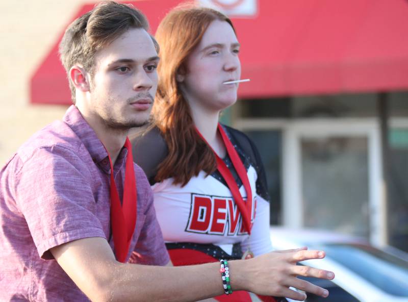 Hall junior attendants Ryan Bosi and Kaylee Lauck ride in the Hall High School Homecoming parade on Thursday, Sept. 28, 2023 in Spring Valley.