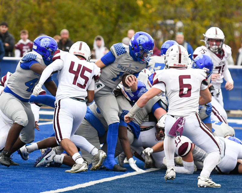 St. Francis's Brock Phillip (1) runs in for a touchdown while being defended by Prairie Ridge during the second round of the 5A playoff game held on Saturday Nov. 8, 2025, held at St. Francis's High School.