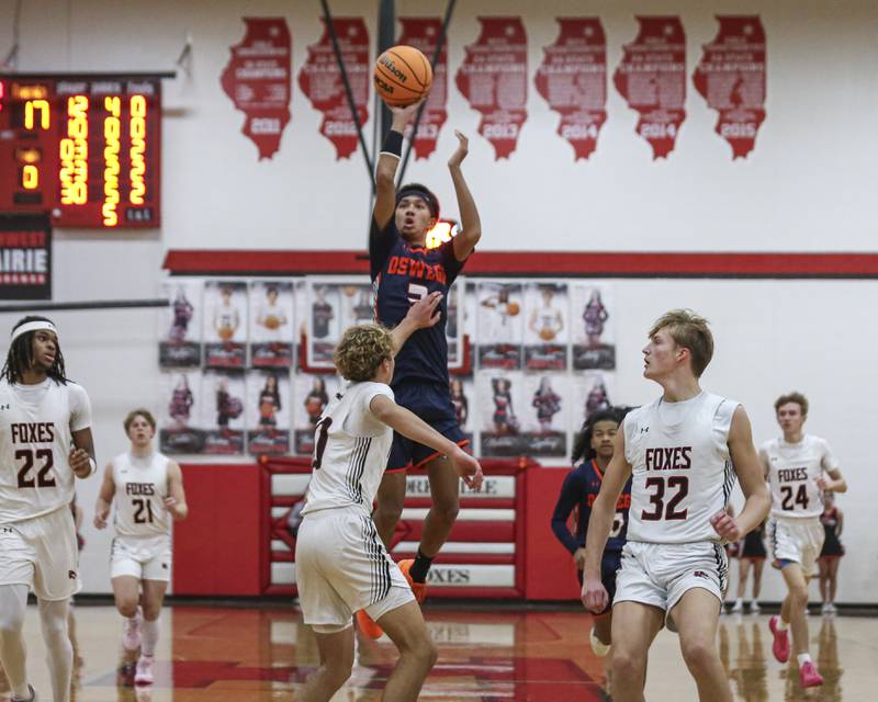 Oswego's Ethan Vahl (3) rises up with a three attempt during their basketball game between Oswego at Yorkville Friday, Dec 12, 2025 in Yorkville.