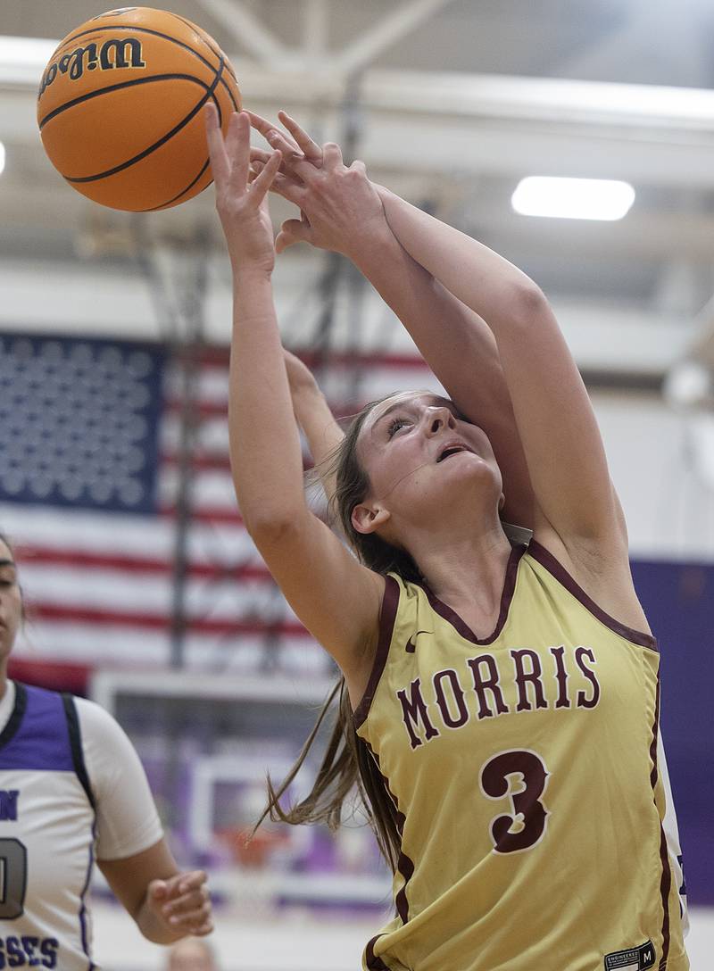 Morris’ Lily Hansen has a shot blocked by Dixon's Makenzie Toms Friday, Jan. 3, 2025, at Dixon High School.