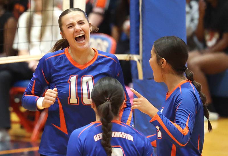 Genoa-Kingston players celebrate a point during their match against DeKalb Wednesday, Sept. 11, 2024, at Genoa-Kingston High School.