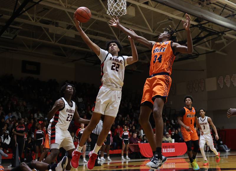 Bolingbrook’s Joshua Pettigrew pulls in a rebound against Romeoville on Wednesday, Jan. 3rd, 2024 in Bolingbrook.