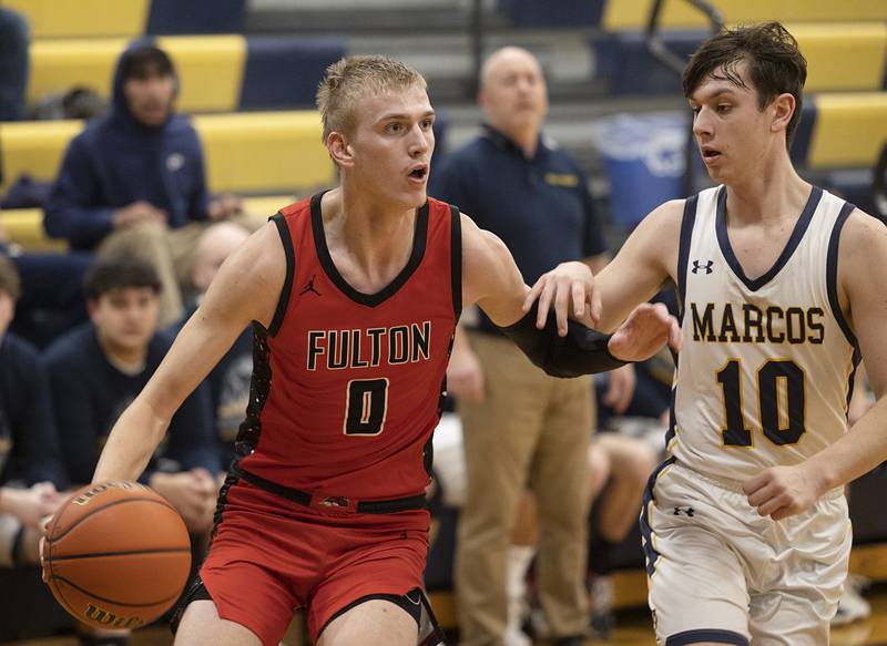 Fulton’s Baylen Damhoff handles the ball against Polo’s Carter Merdian Monday, Feb. 12, 2024 at Polo High School.