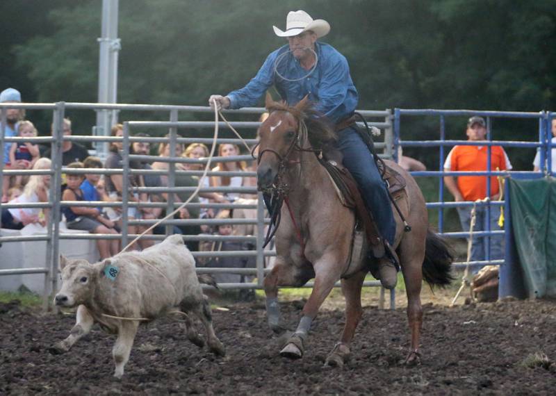 Dave Corcoran of Earlville, competes in the Tie-down Roping during the Broken Horn Rodeo at the La Salle County 4-H Show and Junior Fair on Friday, July 14, 2023 in Ottawa.