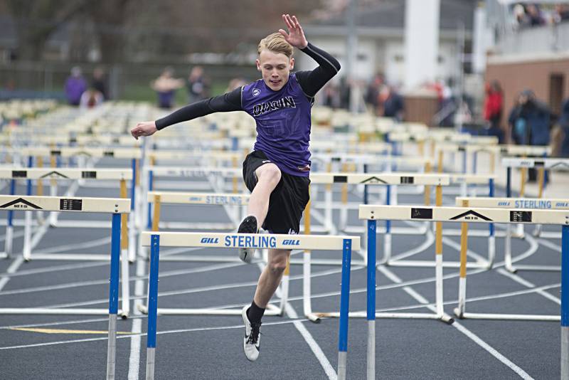 Dixon's Hayden Yingling runs the first leg of the 4x100 hurdle shuttle Friday, April 29, 2022 at the Sterling Night Relays.