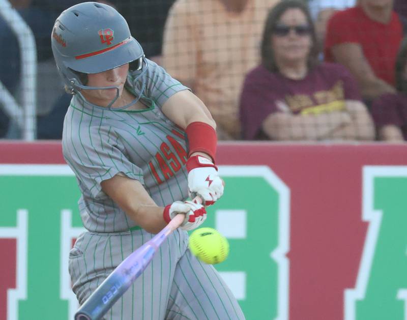 L-P's Mackenzie Chamberlin drives in a run with this swing during the Class 3A Sectional semifinal game on Tuesday, May 26, 2026 at the L-P Athletic Complex in La Salle.