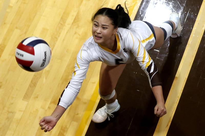 Carmel's Jasmine Reformado tries to save the ball as it heads out of bounds during the IHSA Class 3A Carmel Sectional championship volleyball match against Prairie Ridge on Thursday, Nov. 6, 2025, at Carmel High School, in Mundelein.