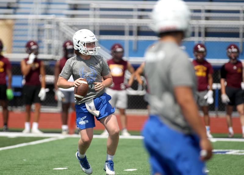 Burlington Central quarterback Jackson Alcorn looks to pass the ball during a 7 on 7 tournament at St. Charles North High School on Thursday, June 30, 2022.