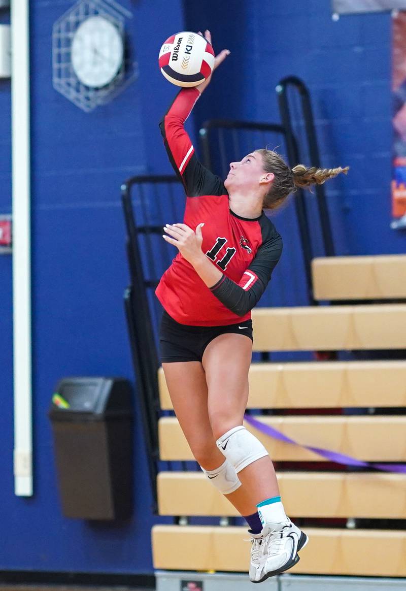 Yorkville's Clare Knoll (11) serves the ball against Oswego during a volleyball match at Oswego High School on Thursday, Sept. 14, 2023.