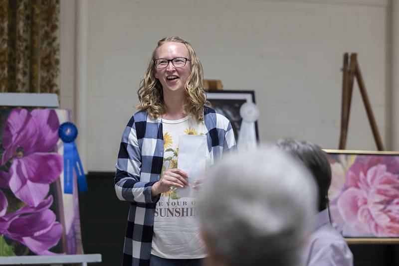 Brandi Benson of Rock Falls smiles after being awarded the Myrtle Walgreen Best of Show Award Thursday, April 16, 2026, at the Phidian Art Show awards ceremony.