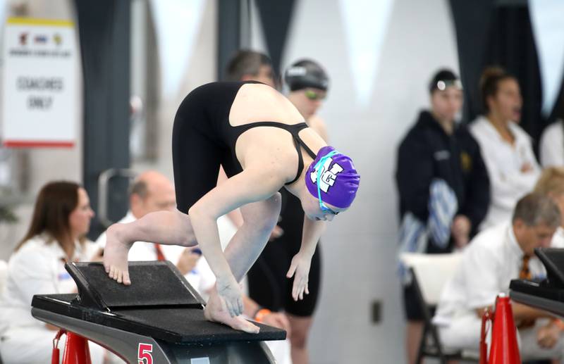 Downers Grove North’s Emily Weingust takes off from the block for the 100-yard butterfly consolation heat during the IHSA Girls State Championships on Saturday, Nov. 16, 2024 at FMC Natatorium in Westmont.