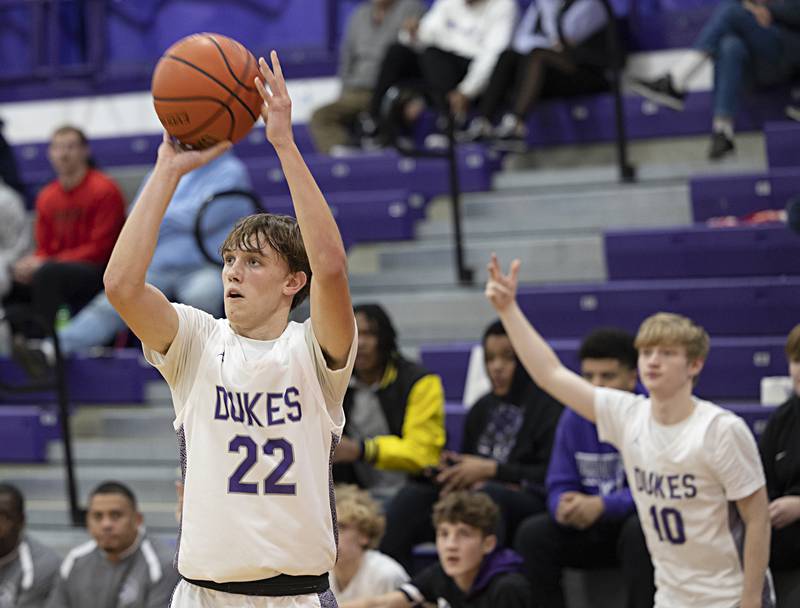 Dixon’s Bryce Feit puts up a shot against Plano Wednesday, Dec. 6, 2023 at Dixon High School.