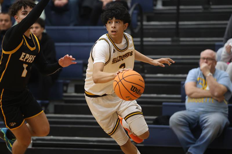 Joliet Catholic’s Danny Cervantes drives along the baseline against Elmwood Park in the Class 3A Joliet Catholic Regional semifinal game on Wednesday, Feb. 25, 2026 in Joliet.