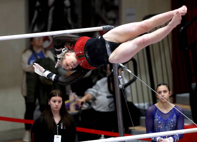 Mundelein’s Lexie Ede competes in the preliminary round of the parallel bars on Friday, Feb. 20, 2026, during the IHSA Girls State Final Gymnastics Meet at Palatine High School.