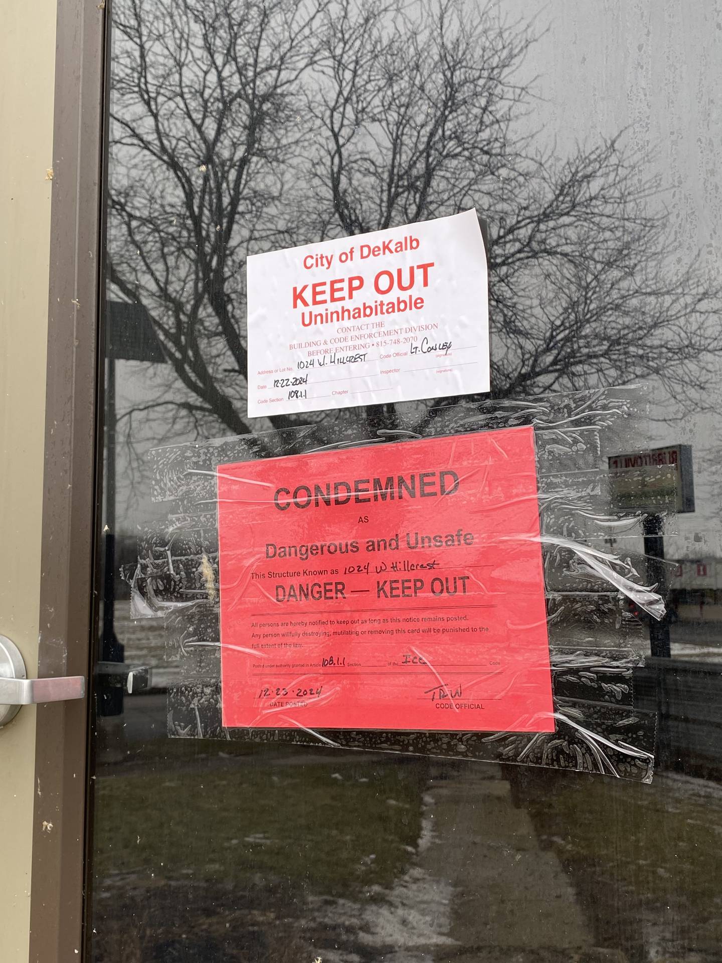 A condemned sign reads "Danger – keep out" attached to the front door of 1024 W. Hillcrest Drive, DeKalb, on Monday, Dec. 23, 2024. The apartment building sustained heavy damage from multi-level fire on Sunday, Dec. 22, 2024, displacing an estimated 60 residents days before Christmas.