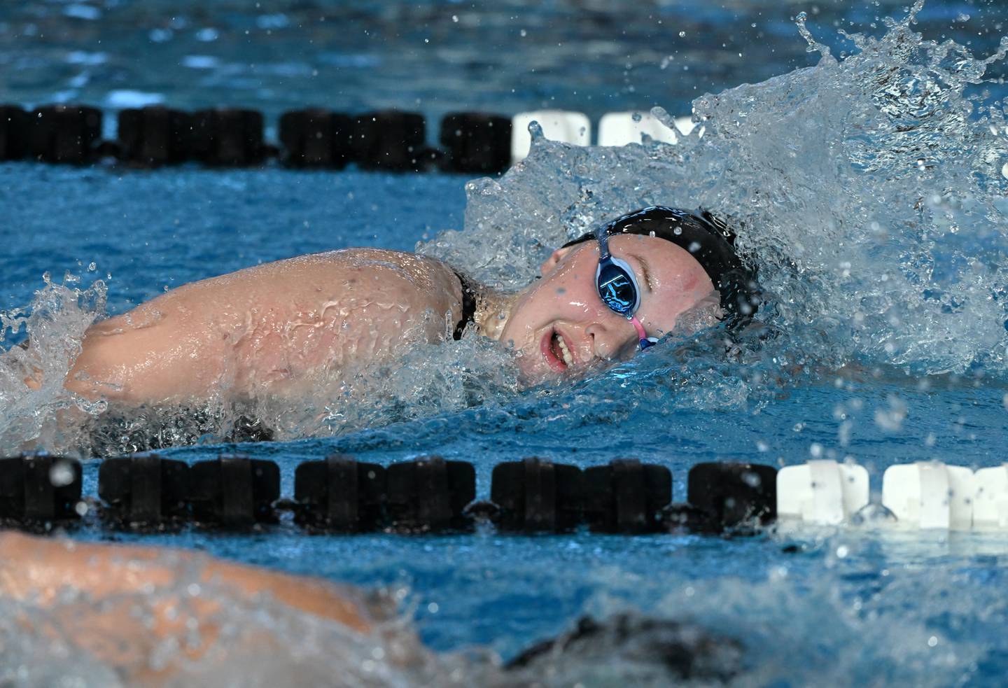 St. Charles North's Kate Farrell takes the lead midway into the 500-yard freestyle during the girls state swimming and diving finals at the FMC Natatorium on Saturday, Nov. 15, 2025 in Westmont.