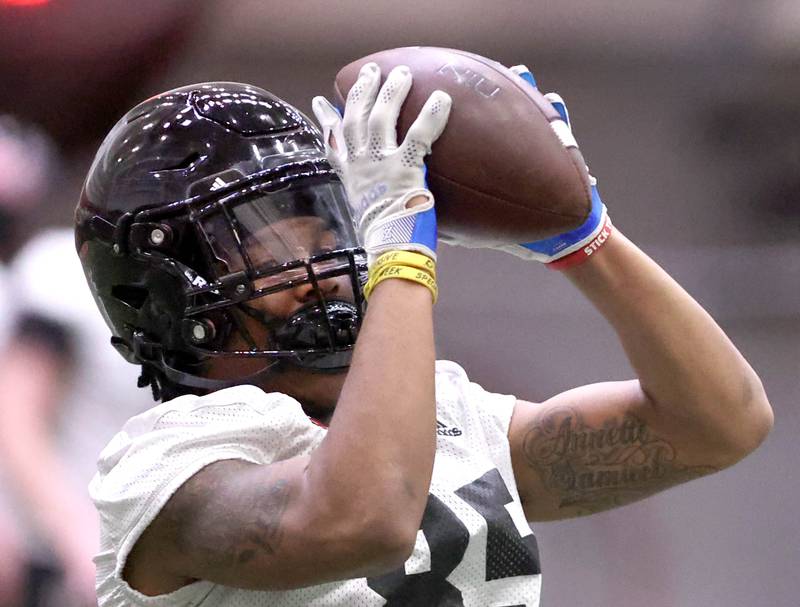 Northern Illinois receiver Trayvon Rudolph catches a pass during the teams first spring practice Wednesday, March 22, 2023, in the Chessick Practice Center at Northern Illinois University in DeKalb.