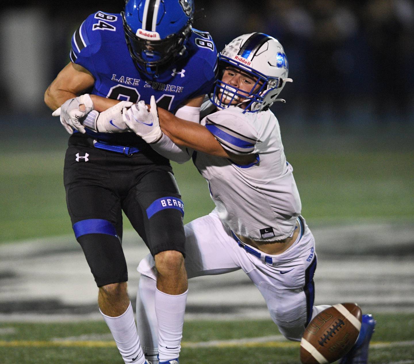 St. Charles North's George Litgen forces and incomplete pass to Lake Zurich's Jack Hartman in a football game in Lake Zurich Friday, September 3, 2021.