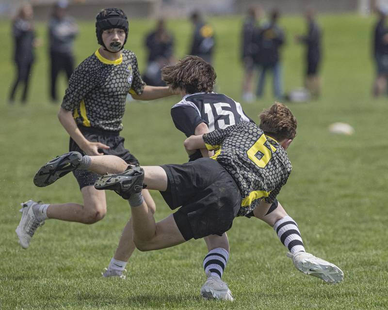 Elliott Rothel of the South Suburban Cobras attempts a diving tackle against Liam Comer of the West Suburban Barbarians during the game at Veterans Park on April 28, 2024.