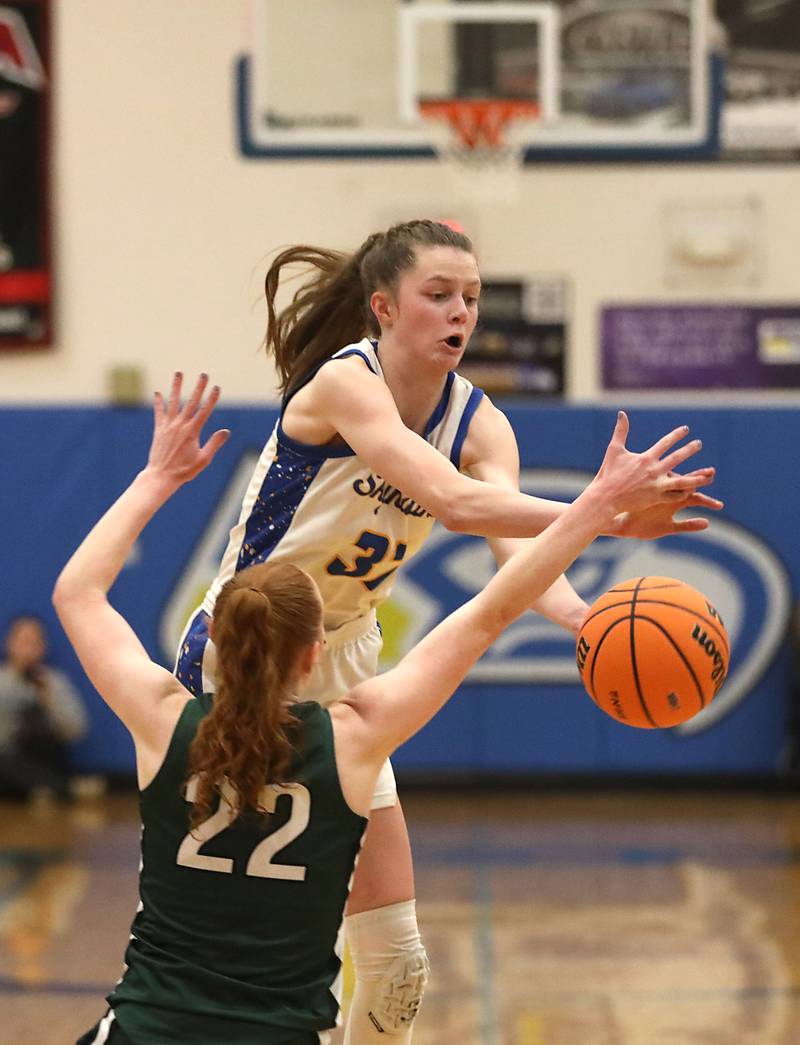 Johnsburg's Skye Toussaint tries to grab a pass in front of St. Edward's Layne Dawson during the IHSA Class 2A Johnsburg Sectional girls basketball championship game on Thursday, February, 26, 2026, at Johnsburg High School.